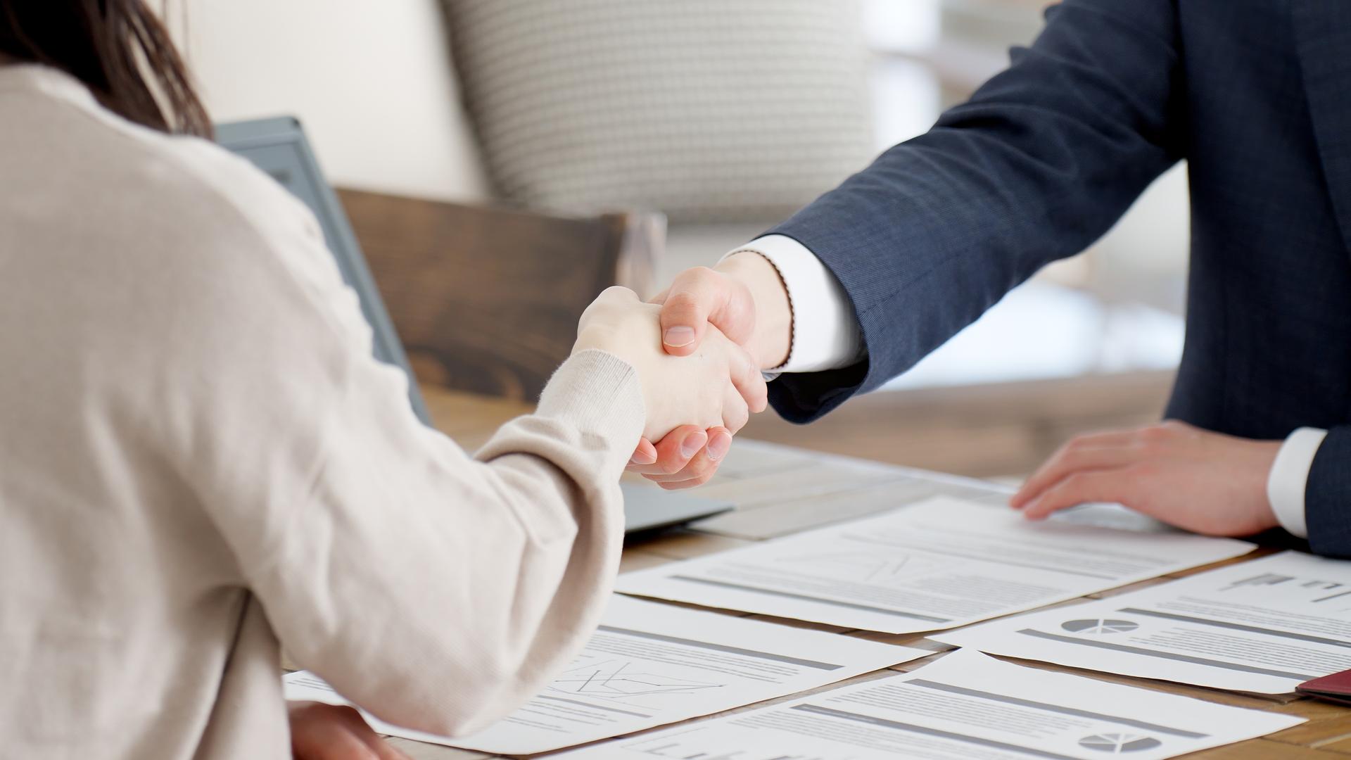 Businessmen shaking hands during a sales call